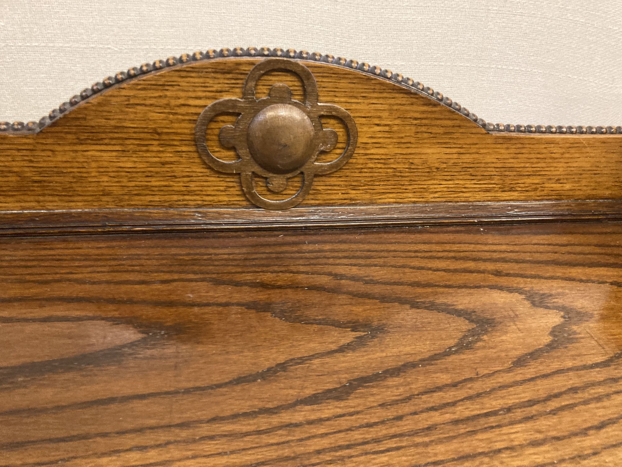 A 1920s oak bow front bookcase, length 73cm, width 26cm, height 110cm